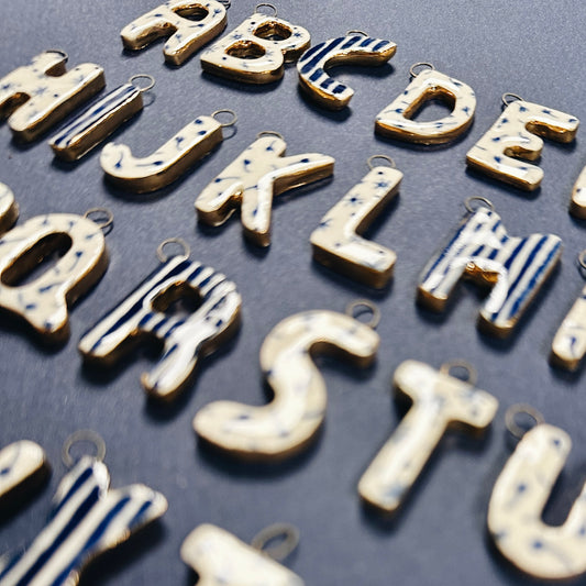 HANDMADE CERAMIC MONOGRAM CHARMS EMBELLISHED WITH 10K GOLD LUSTRE