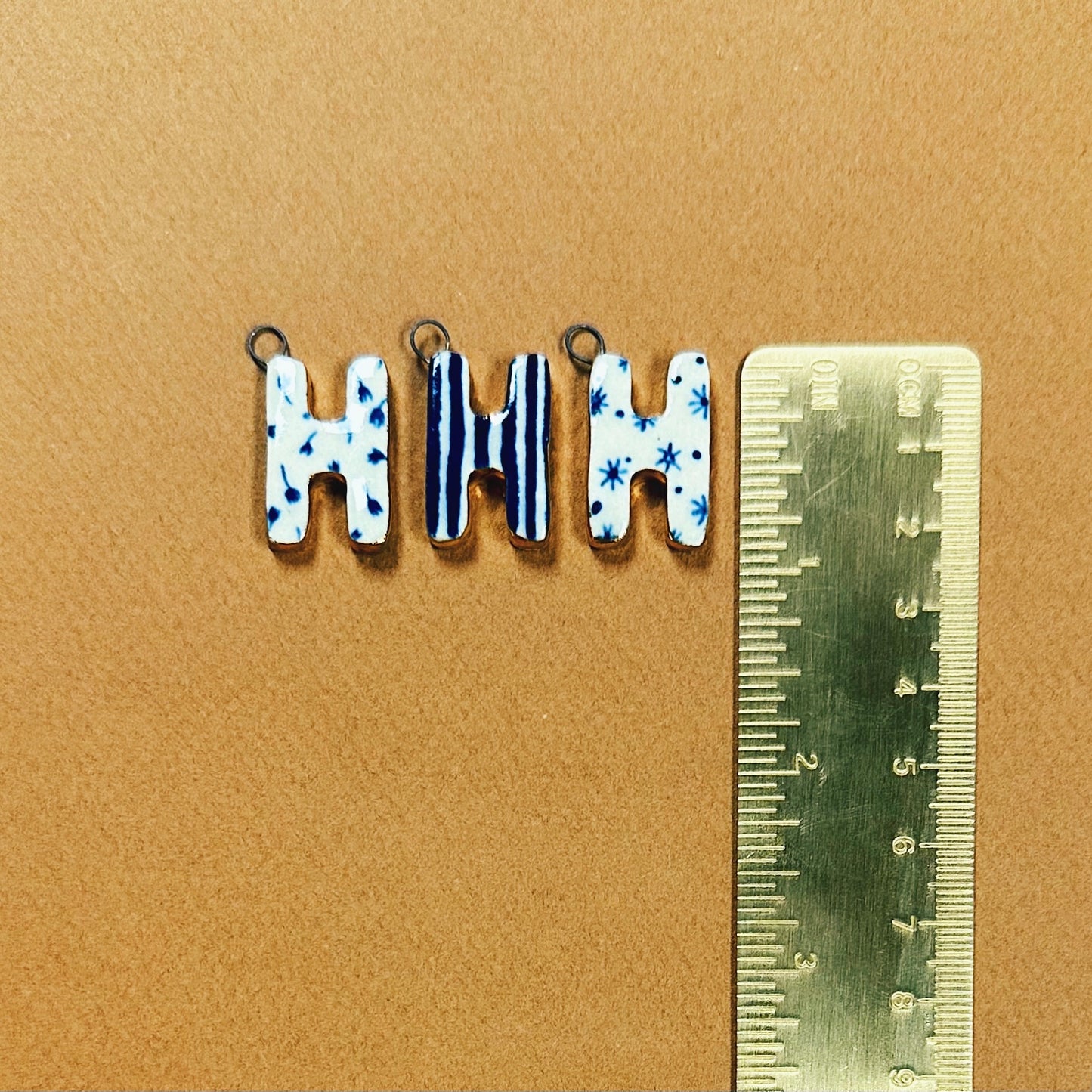 HANDMADE CERAMIC MONOGRAM CHARMS EMBELLISHED WITH 10K GOLD LUSTRE