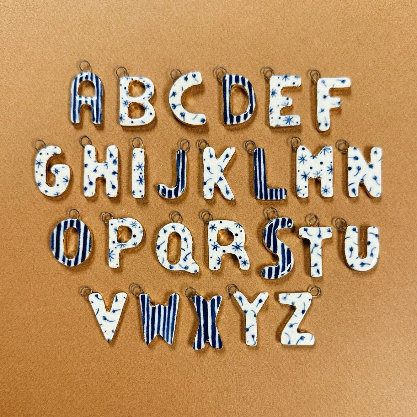 HANDMADE CERAMIC MONOGRAM CHARMS EMBELLISHED WITH 10K GOLD LUSTRE