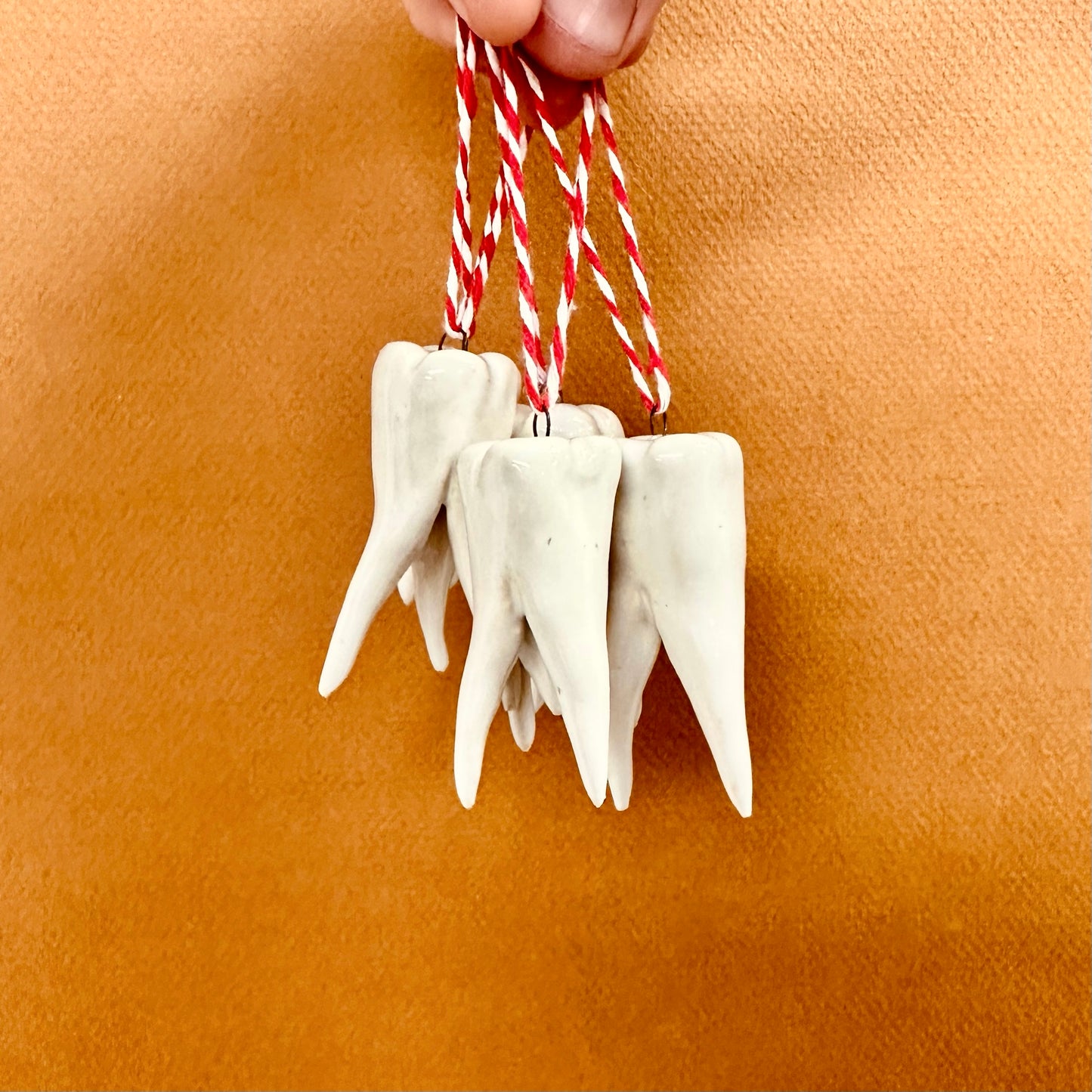 HAND-SCULPTED TOOTH ORNAMENT