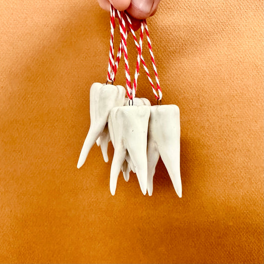HAND-SCULPTED TOOTH ORNAMENT