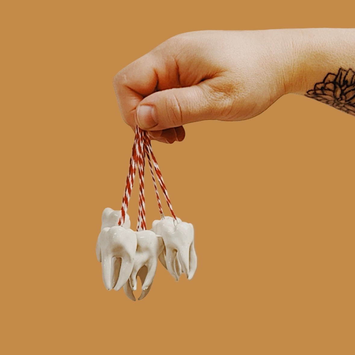 HAND-SCULPTED TOOTH ORNAMENT